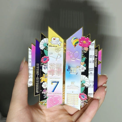 Indoor Handheld Close Up View of BTS 10th Anniversary Enamel Pin